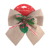 X-mas Deco Ribbon Hemp decorative bow with festive holly and pine accents for Christmas decorations.